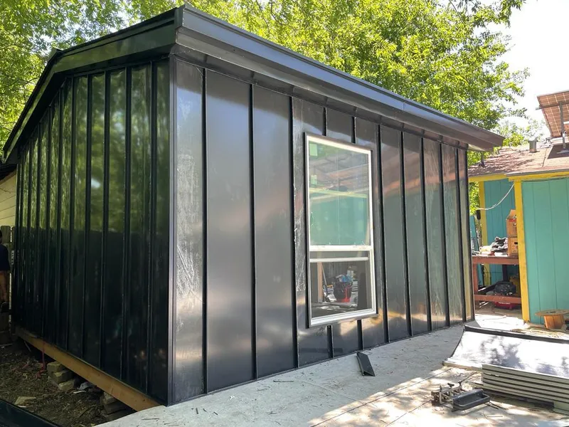 Black standing seam metal wall panels for Metal Roof Installation in Schuyler Falls