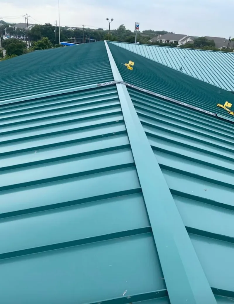 Green commercial metal roof ridge and valley for Metal Roof Repair in Schuyler Falls
